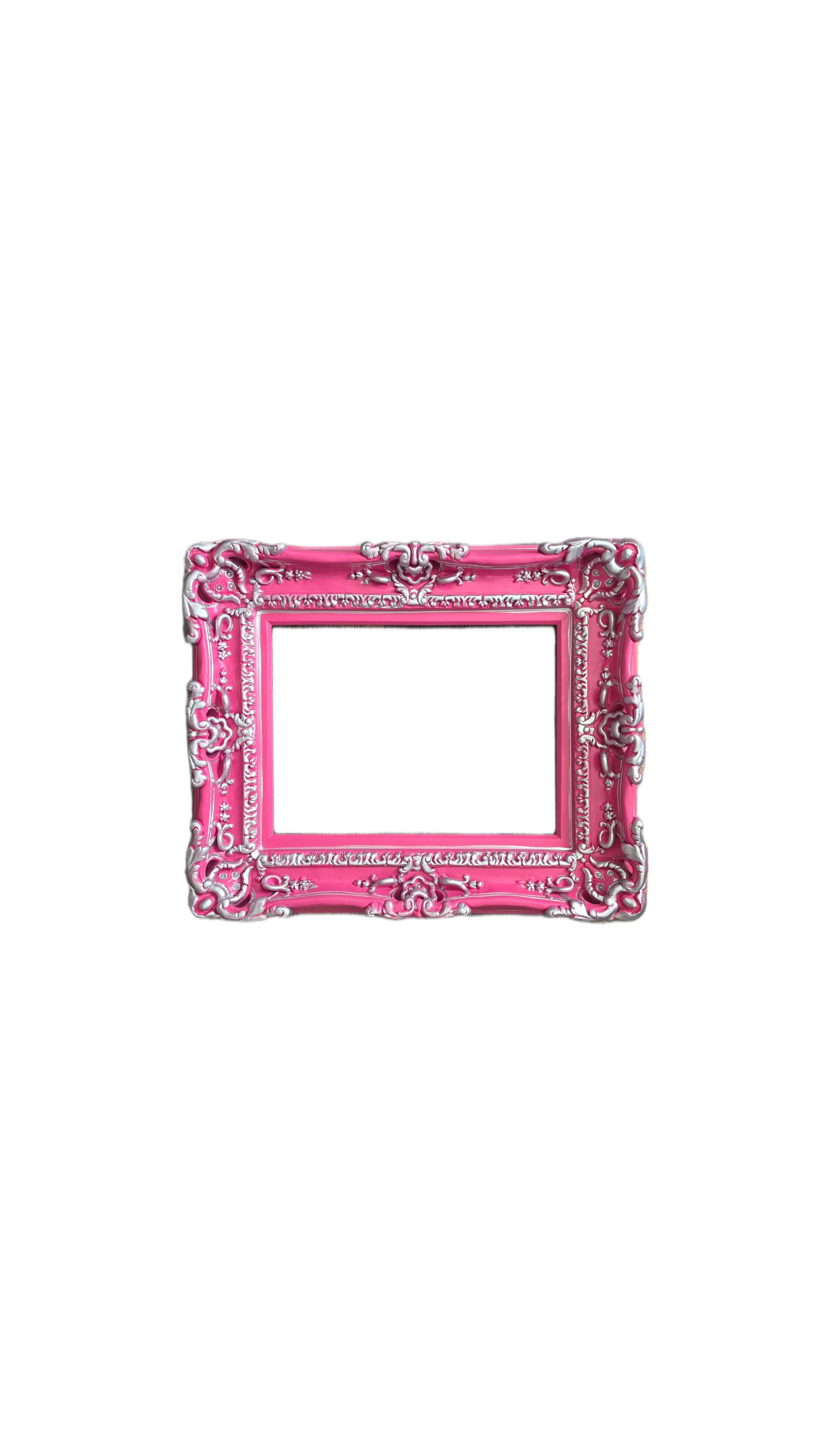 Pink decorative picture frame with intricate designs on a white background